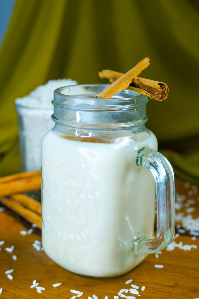 Mastering the First Impression: Your intriguing post title goes here Delicious Mexican horchata drink in a glass mug, garnished with cinnamon sticks. Perfect for refreshing summer days.